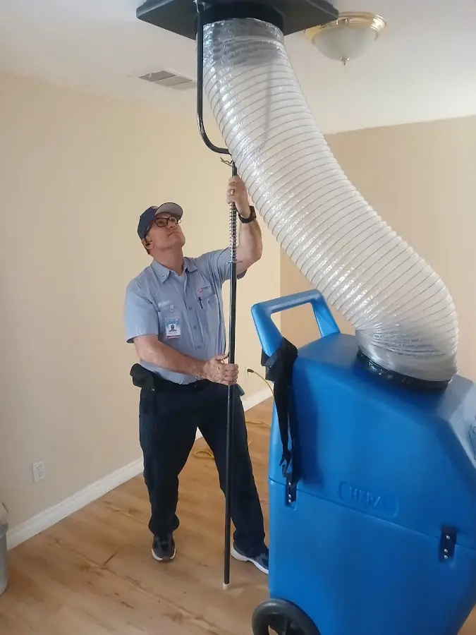 Furnace Tune-Up technician using HEPA equipment in Streetsboro